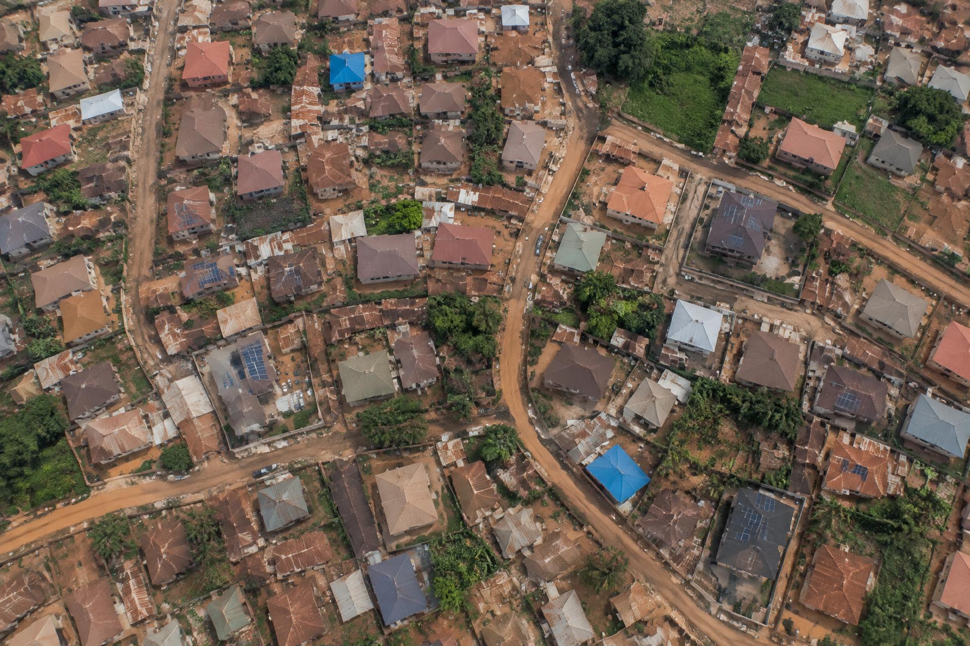 Aerial view of a community with solar panels on rooftops